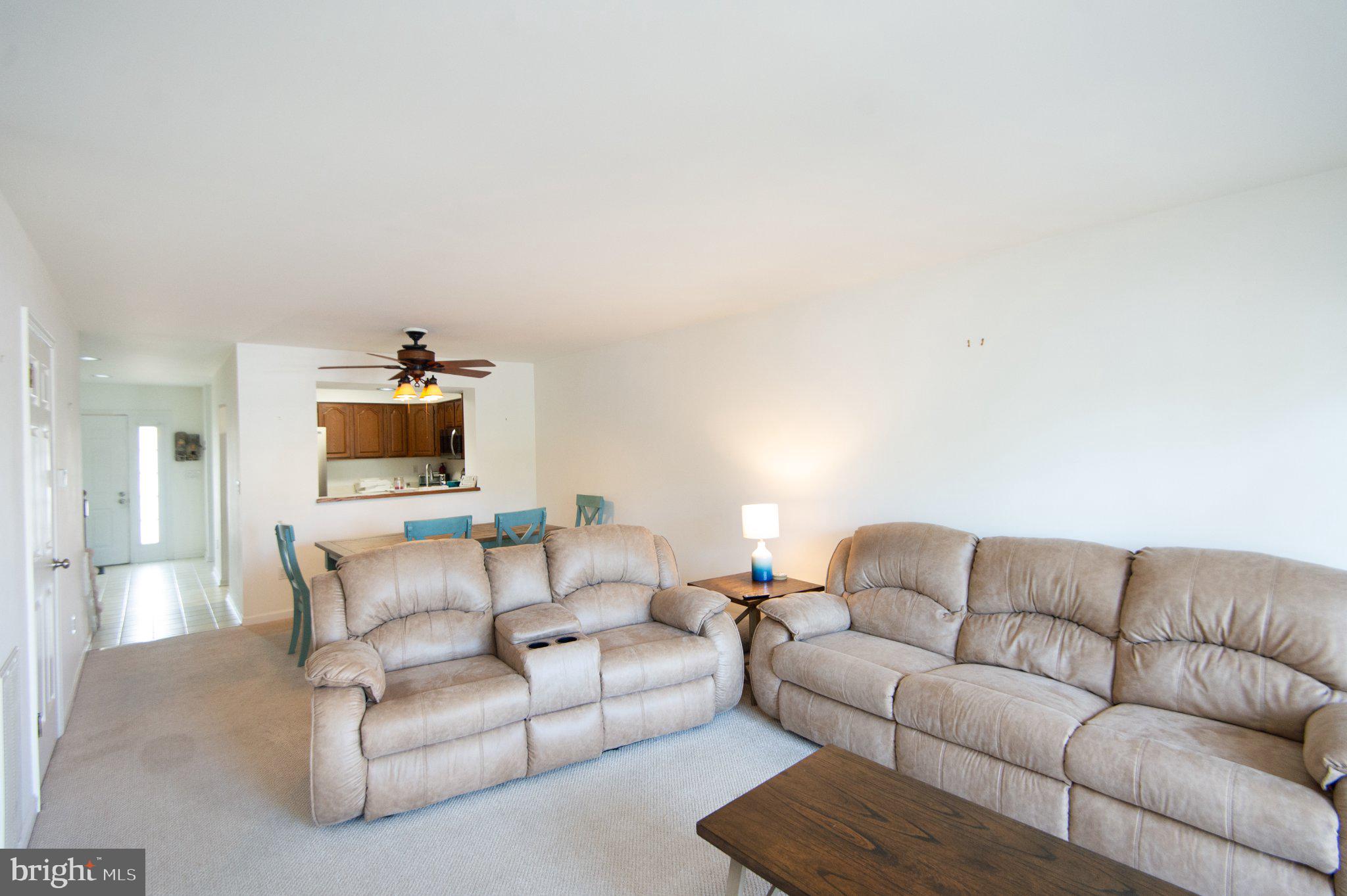 101 Main Street, Unit 119 Secretary, MD 21664 - Photo 15 of 58 Spacious living area with natural light.