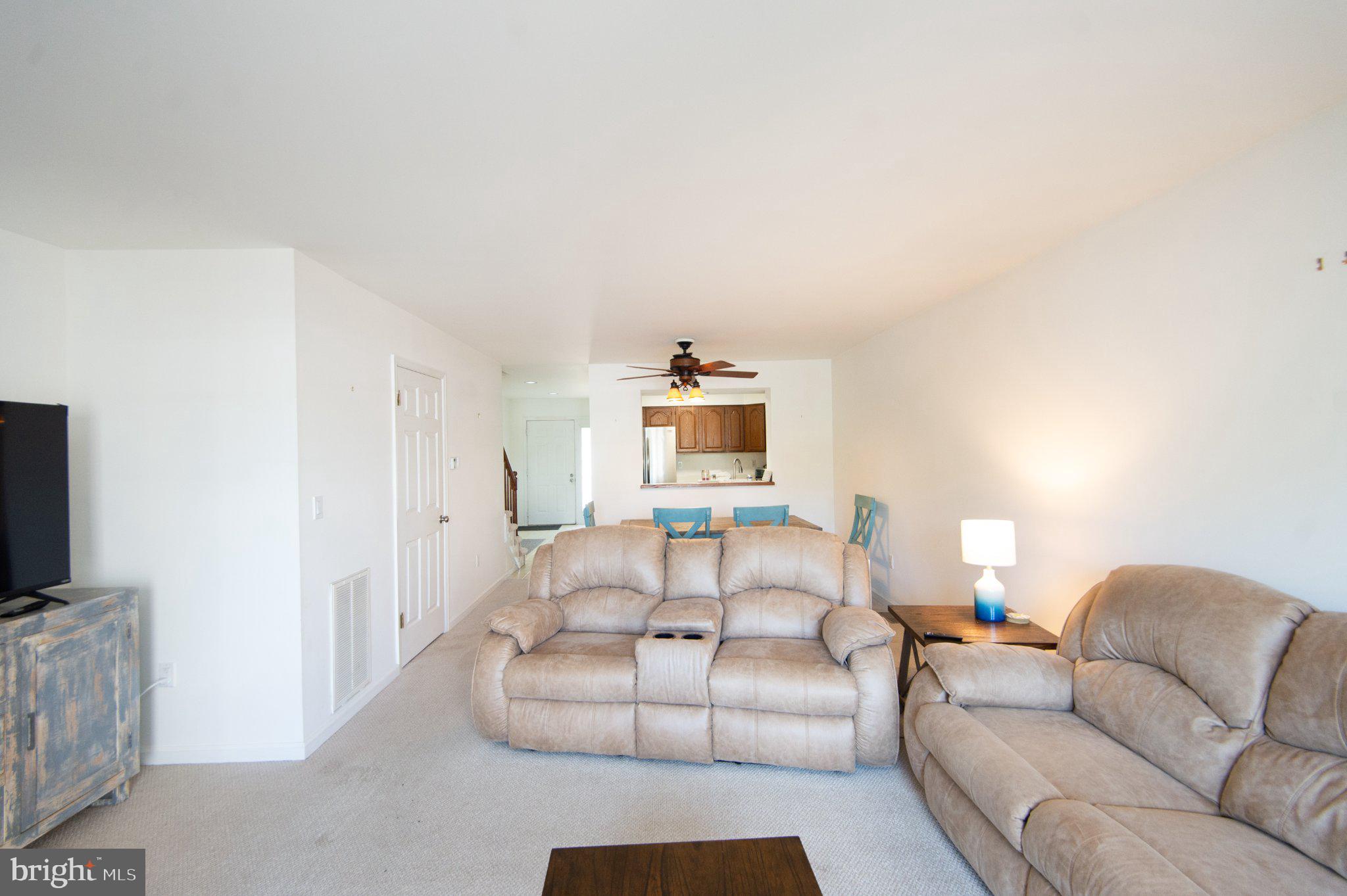 101 Main Street, Unit 119 Secretary, MD 21664 - Photo 16 of 58 Spacious living area with natural light.