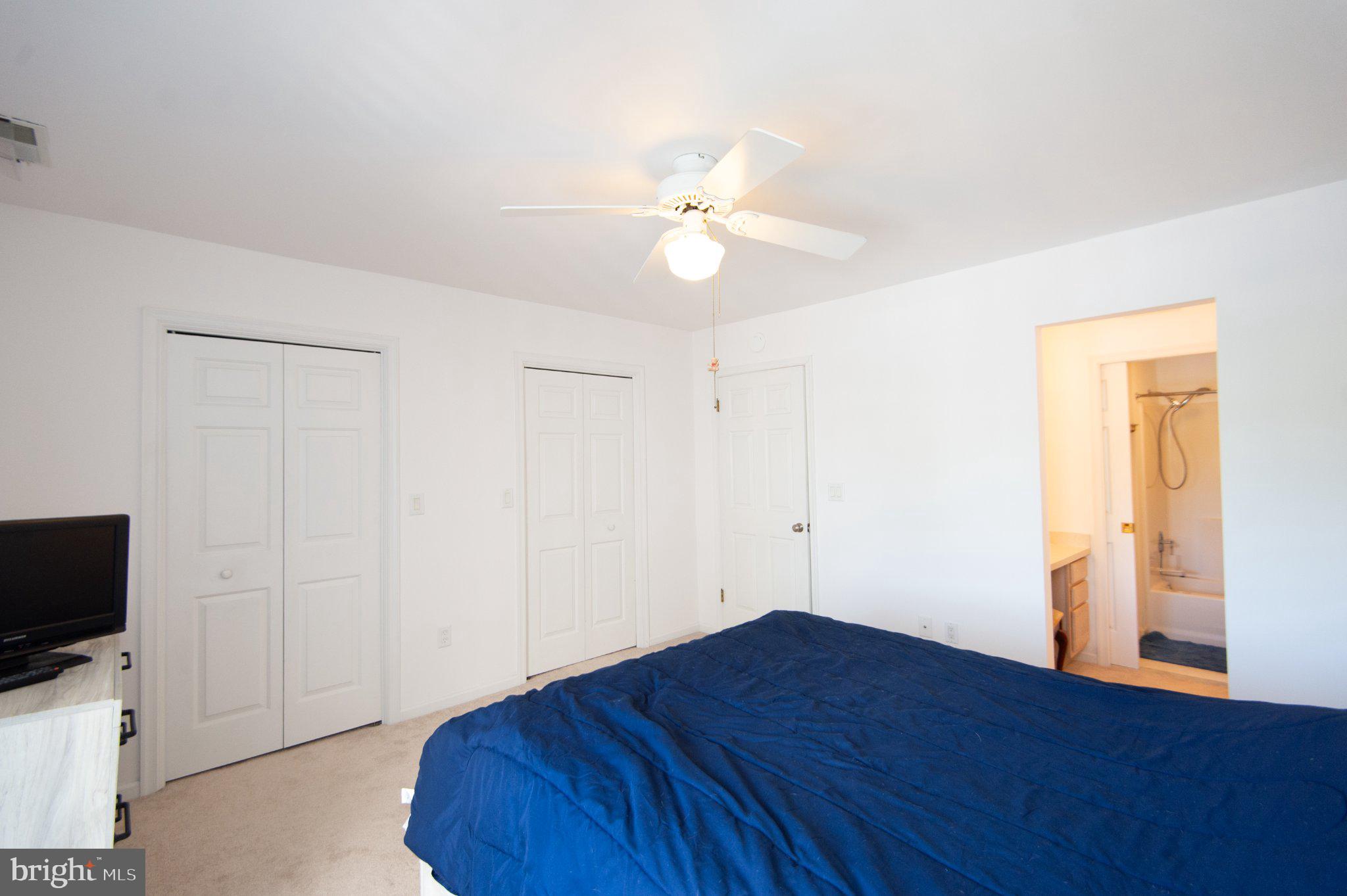 101 Main Street, Unit 119 Secretary, MD 21664 - Photo 27 of 58 Bright and airy bedroom retreat.