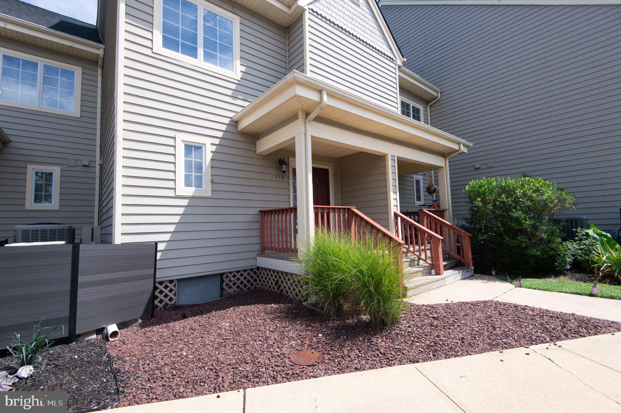 101 Main Street, Unit 119 Secretary, MD 21664 - Photo 3 of 58 Charming entrance with lush landscaping.