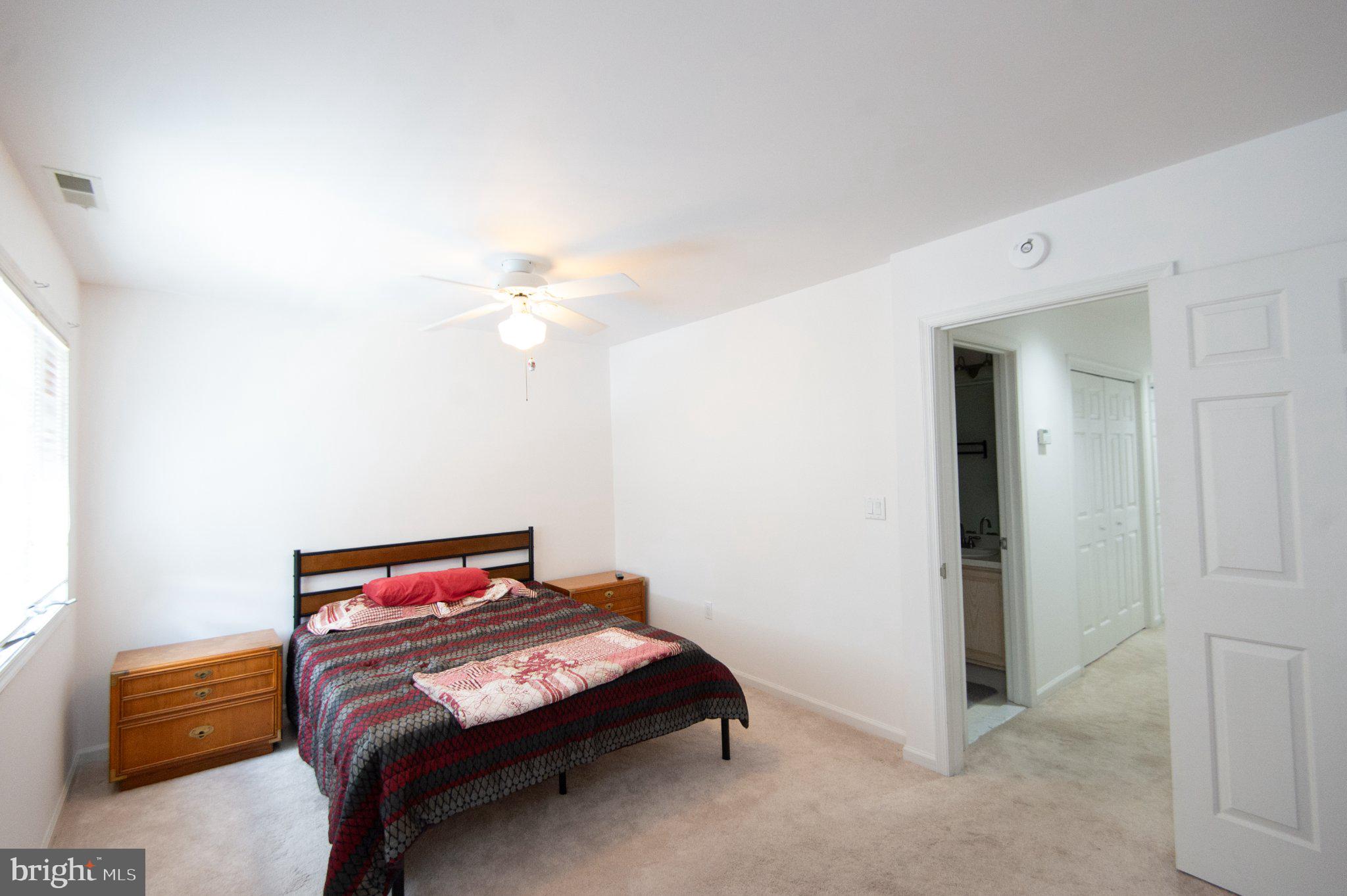 101 Main Street, Unit 119 Secretary, MD 21664 - Photo 36 of 58 Bright and airy bedroom retreat.