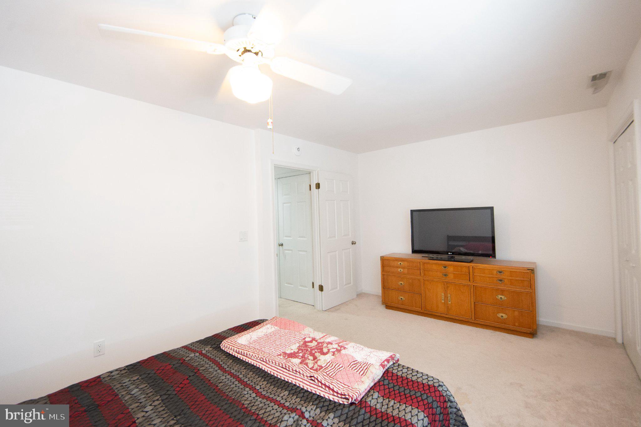 101 Main Street, Unit 119 Secretary, MD 21664 - Photo 37 of 58 Bright and airy bedroom retreat.