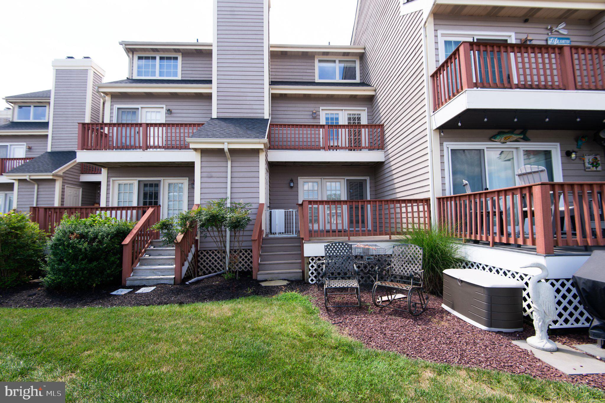 101 Main Street, Unit 119 Secretary, MD 21664 - Photo 46 of 58 Charming townhome with inviting decks.