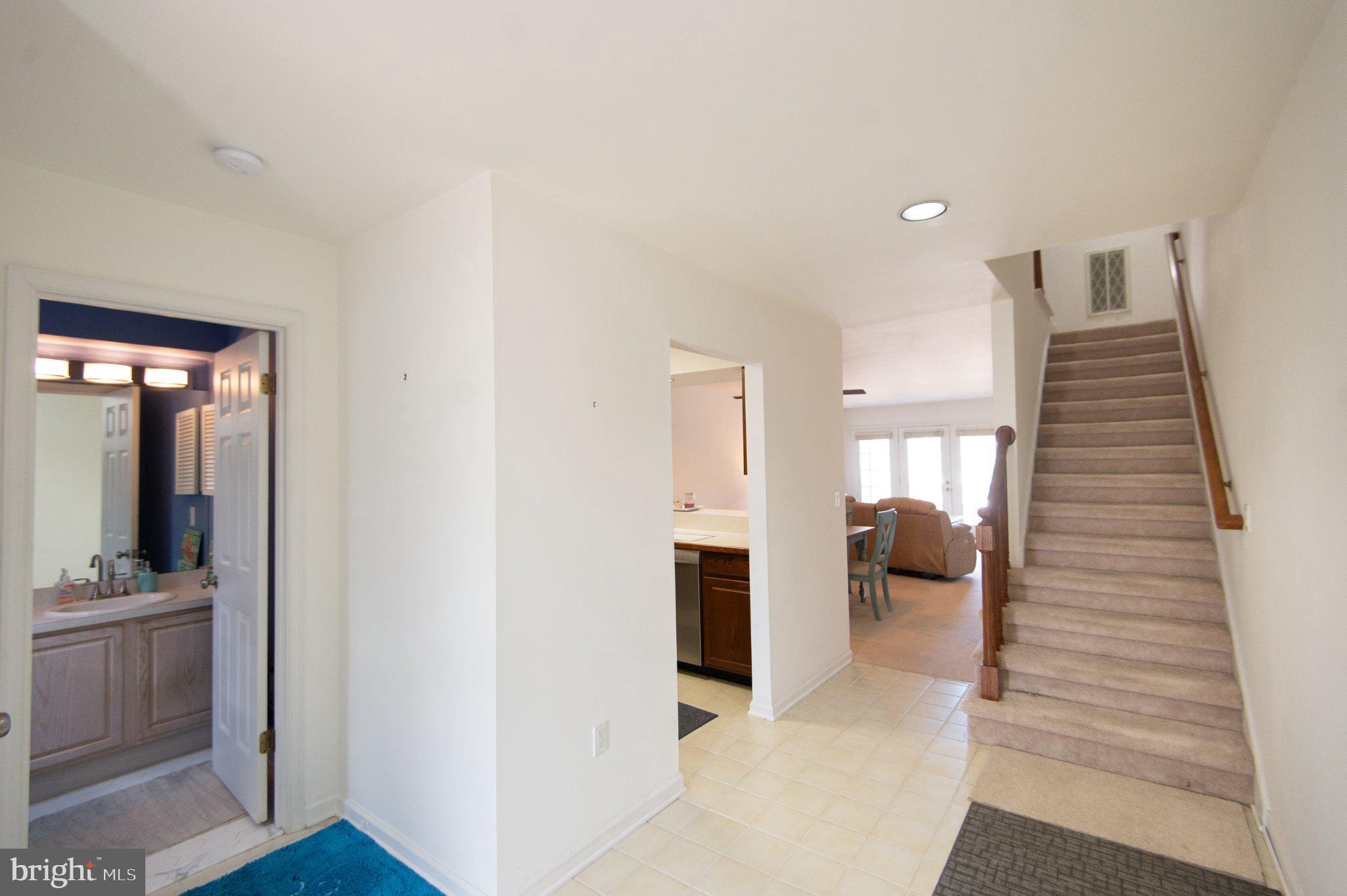 101 Main Street, Unit 119 Secretary, MD 21664 - Photo 5 of 58 Inviting entryway with open layout.
