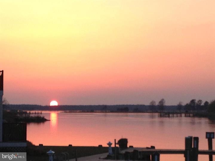 101 Main Street, Unit 119 Secretary, MD 21664 - Photo 54 of 58 Serene sunset over tranquil waters.