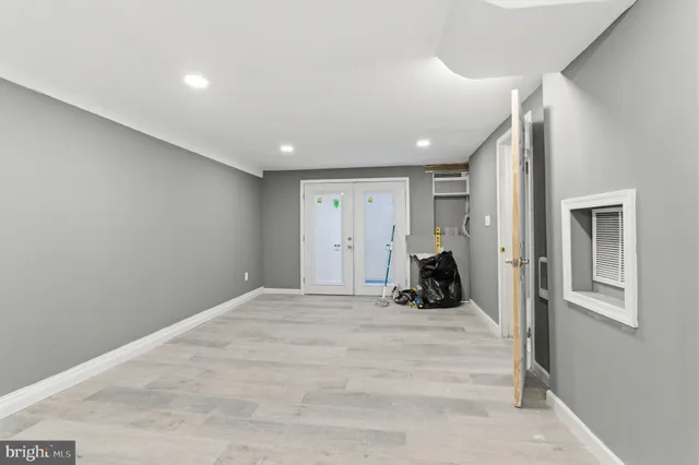 a view of a hallway with washer and dryer