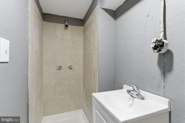 a kitchen with granite countertop stainless steel appliances and wooden cabinets
