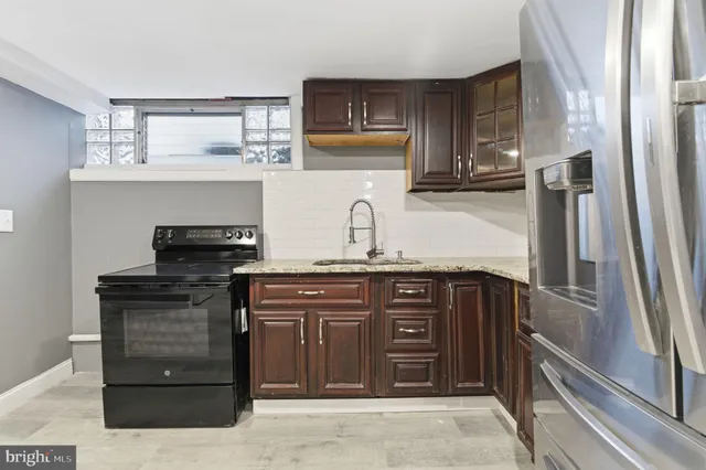 a view of a kitchen with washer and dryer