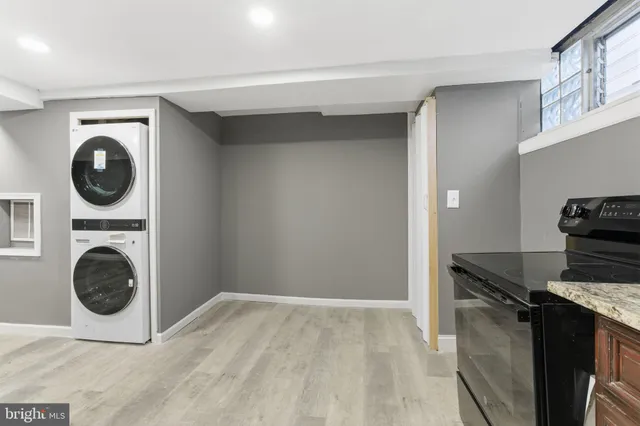 a kitchen with a stove top oven sink and cabinets