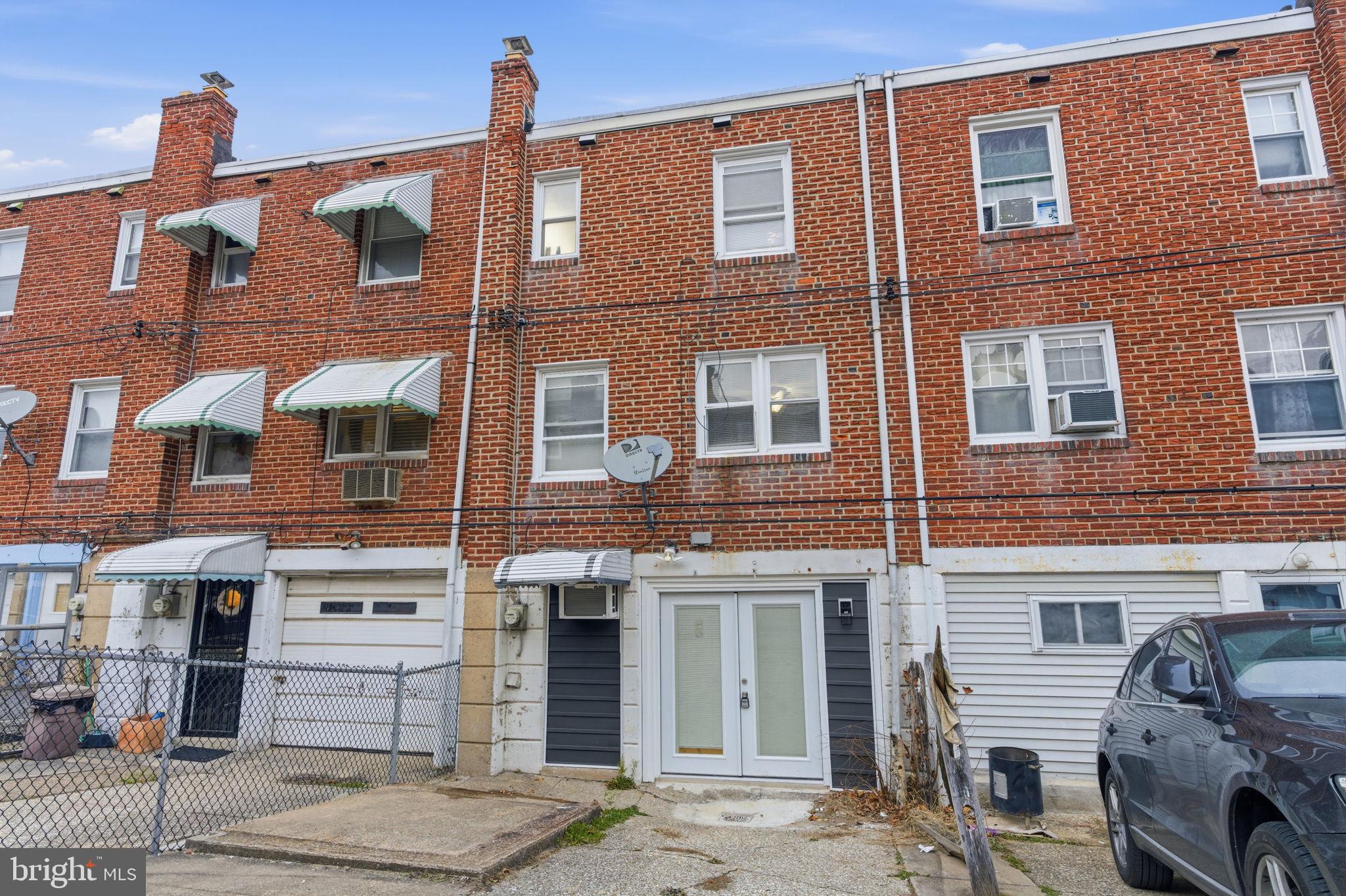 4524 Robbins Street Philadelphia, PA 19135 - Photo 25 of 26 a front view of a building with many windows