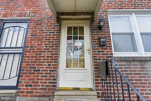 a view of front door of house with stairs