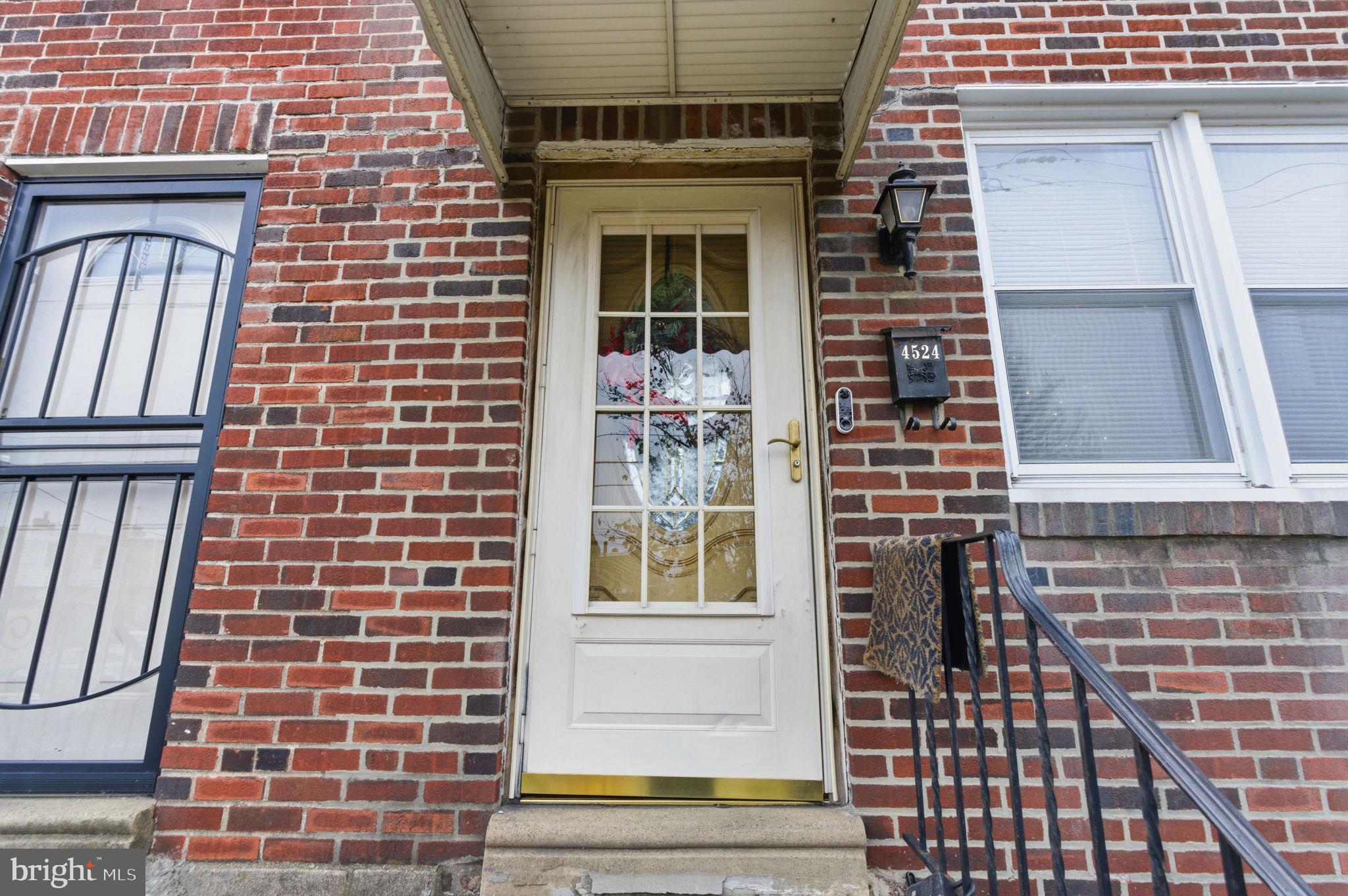 4524 Robbins Street Philadelphia, PA 19135 - Photo 3 of 26 a view of front door of house with stairs