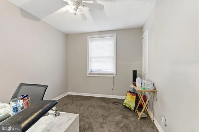 a view of a workspace with furniture