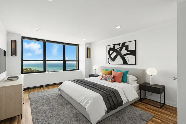 a bedroom with a bed and window