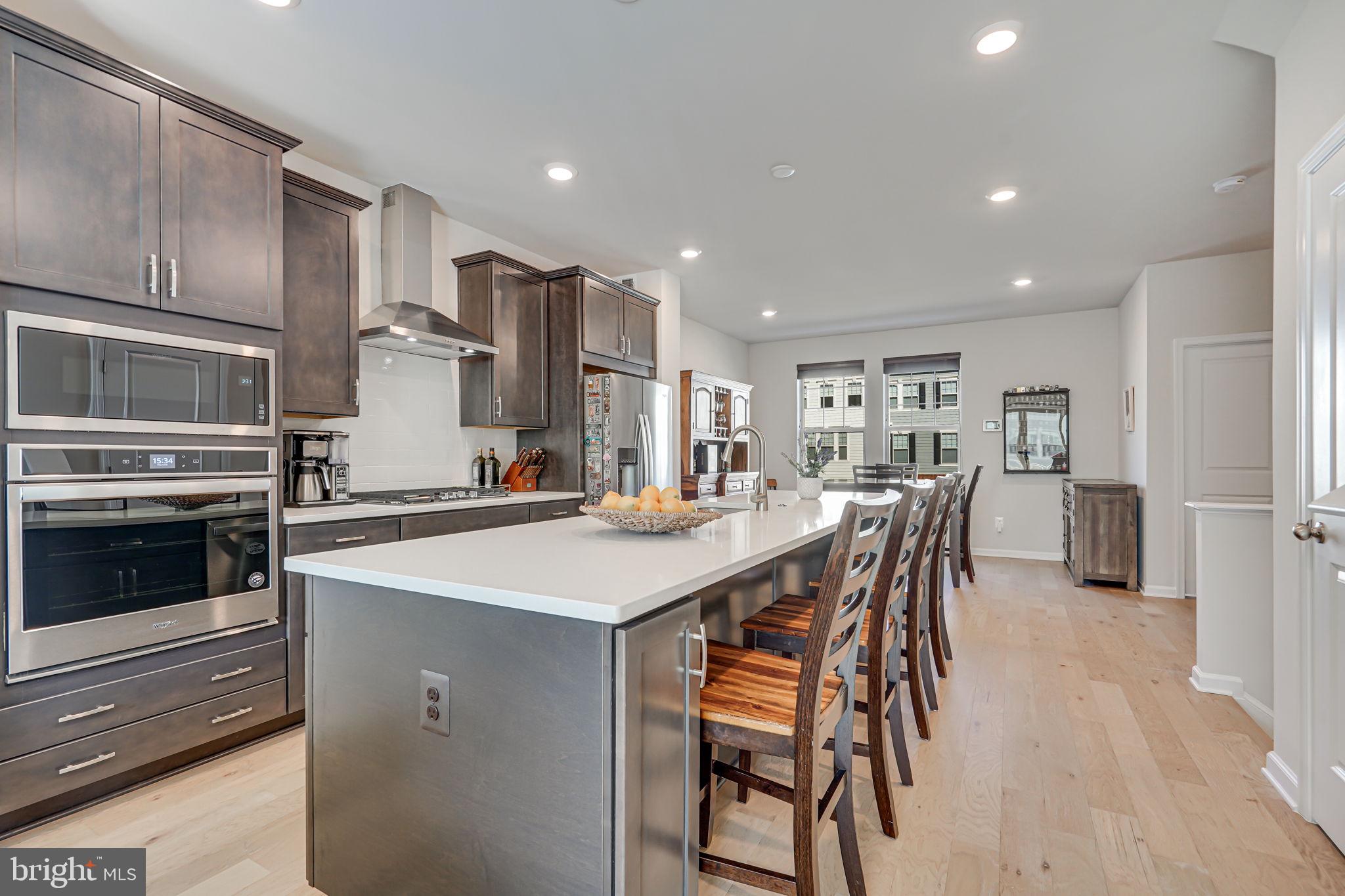 9536 Barnes Loop Manassas, VA 20110 - Photo 12 of 24 a large kitchen with a table and chairs