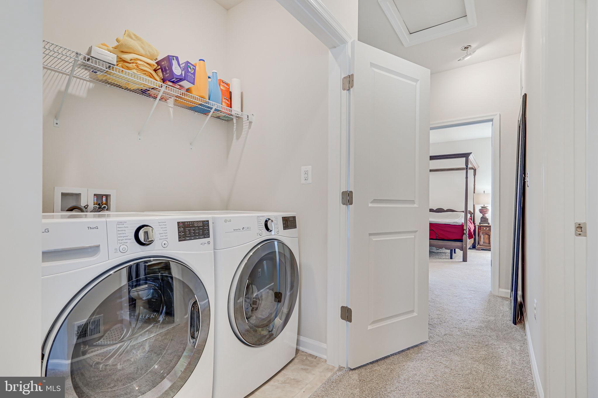 9536 Barnes Loop Manassas, VA 20110 - Photo 18 of 24 a utility room with dryer and washer