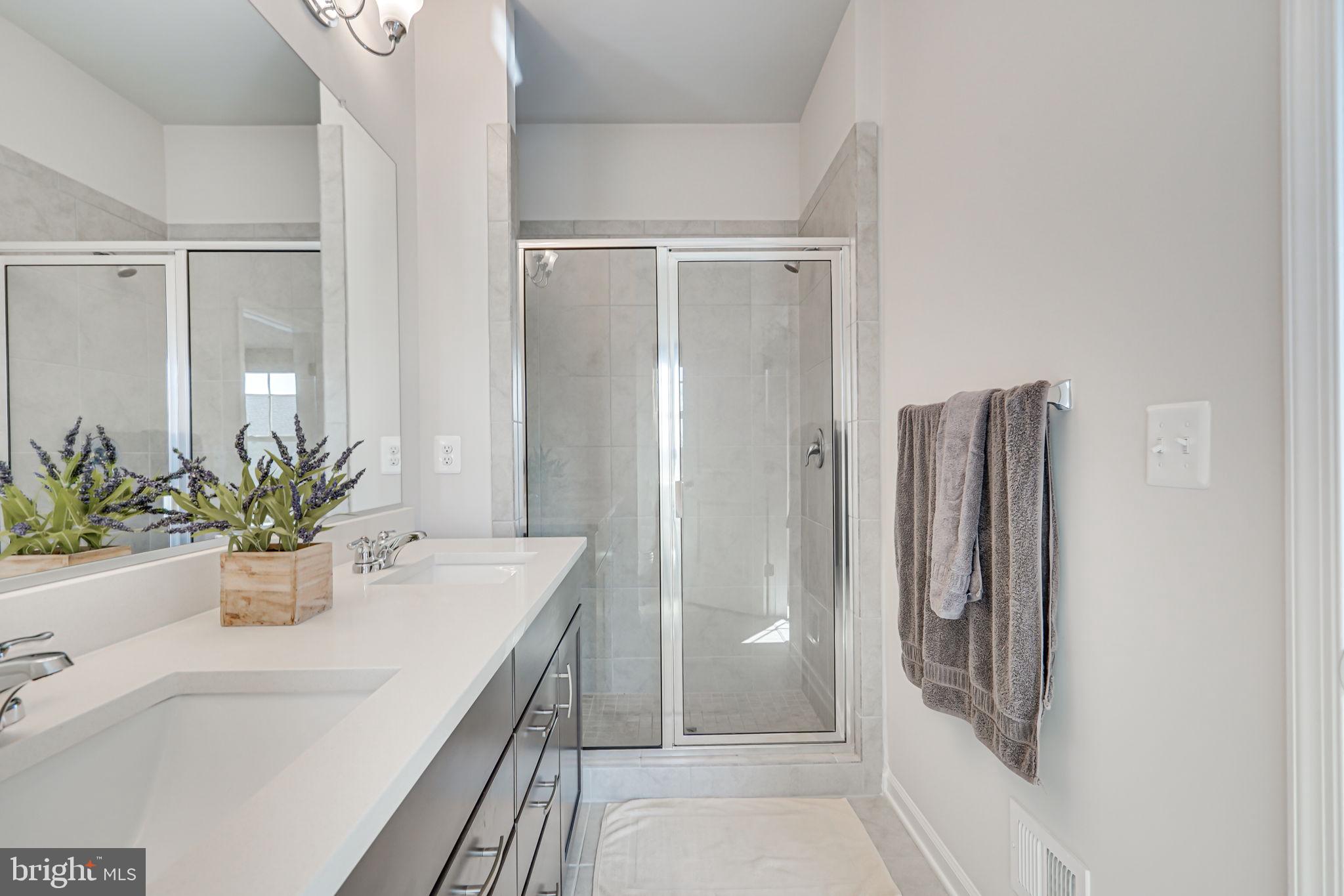 9536 Barnes Loop Manassas, VA 20110 - Photo 21 of 24 a bathroom with a granite countertop shower and a sink