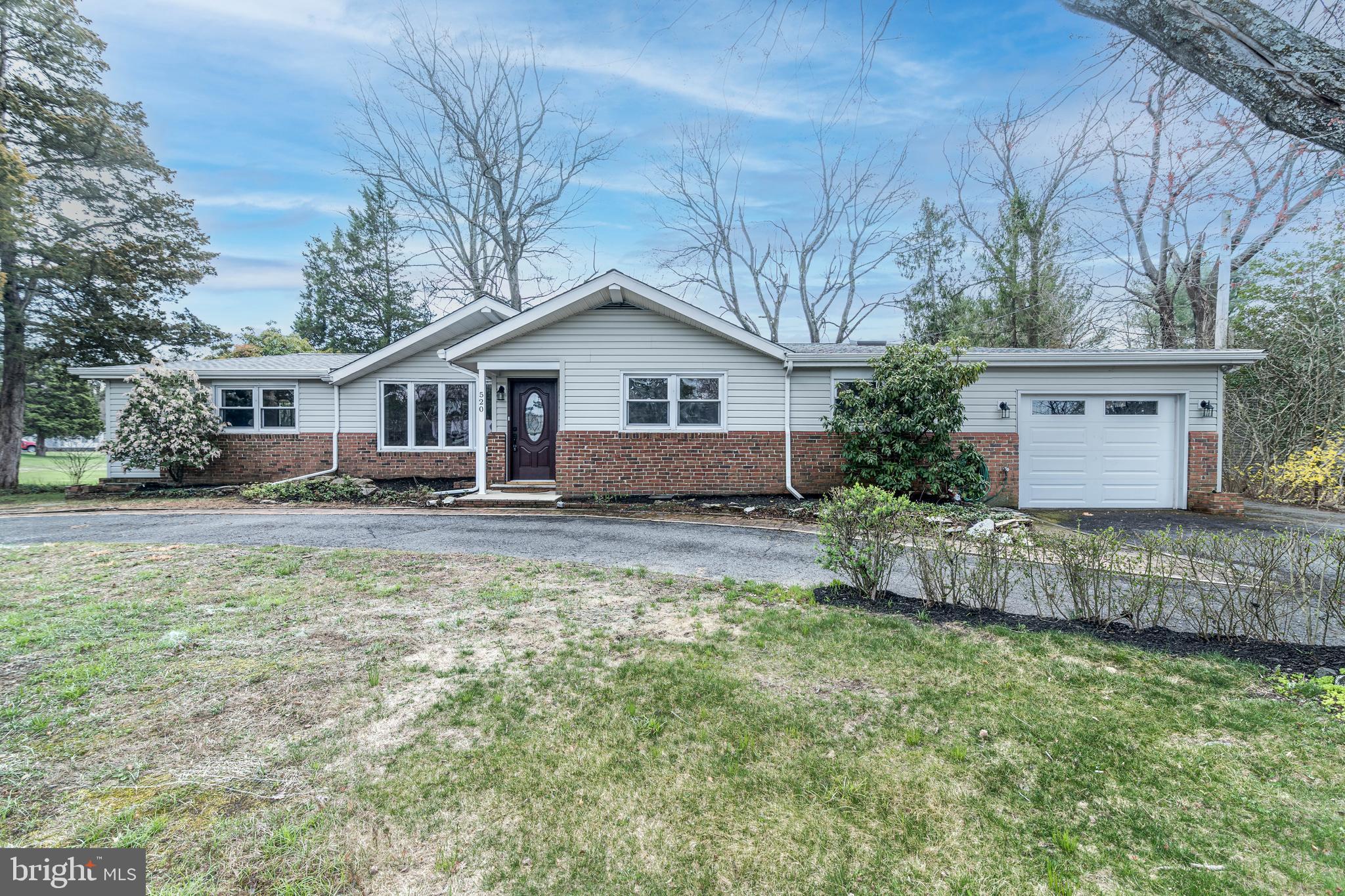 520 Powell Road Mount Holly, NJ 08060 - Photo 1 of 65 a front view of a house with garden
