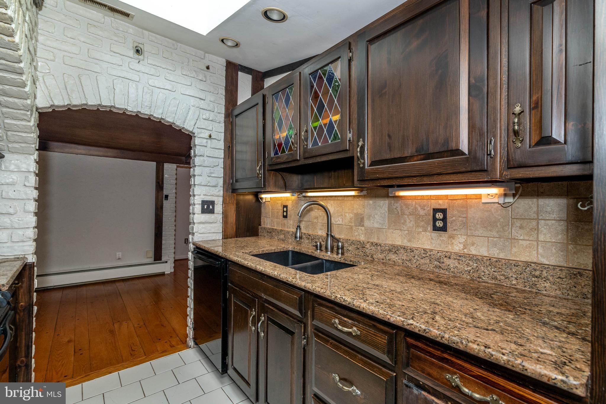520 Powell Road Mount Holly, NJ 08060 - Photo 13 of 65 a kitchen with granite countertop wood cabinets and stainless steel appliances