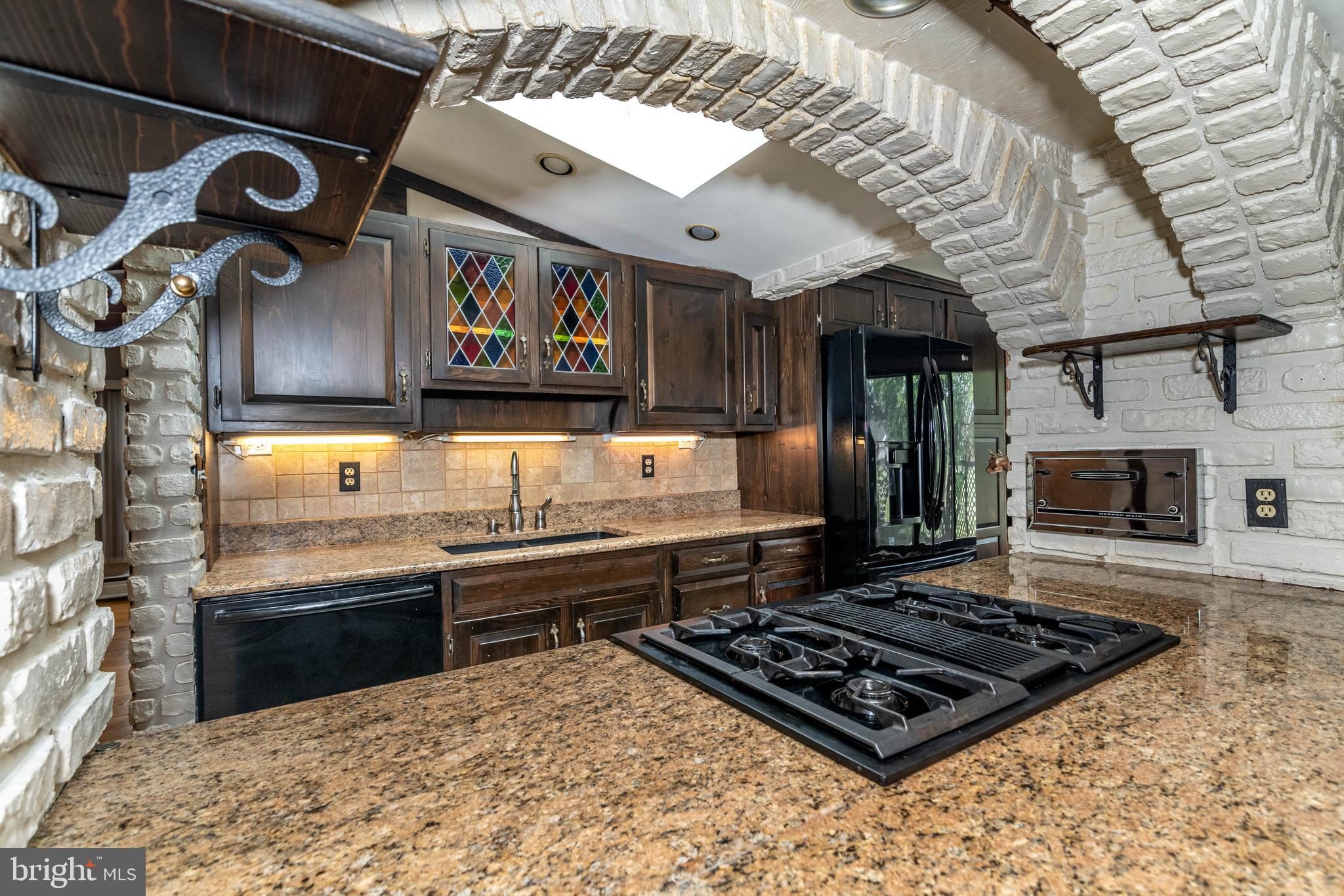 520 Powell Road Mount Holly, NJ 08060 - Photo 18 of 65 a kitchen with stainless steel appliances granite countertop a stove a sink and a microwave