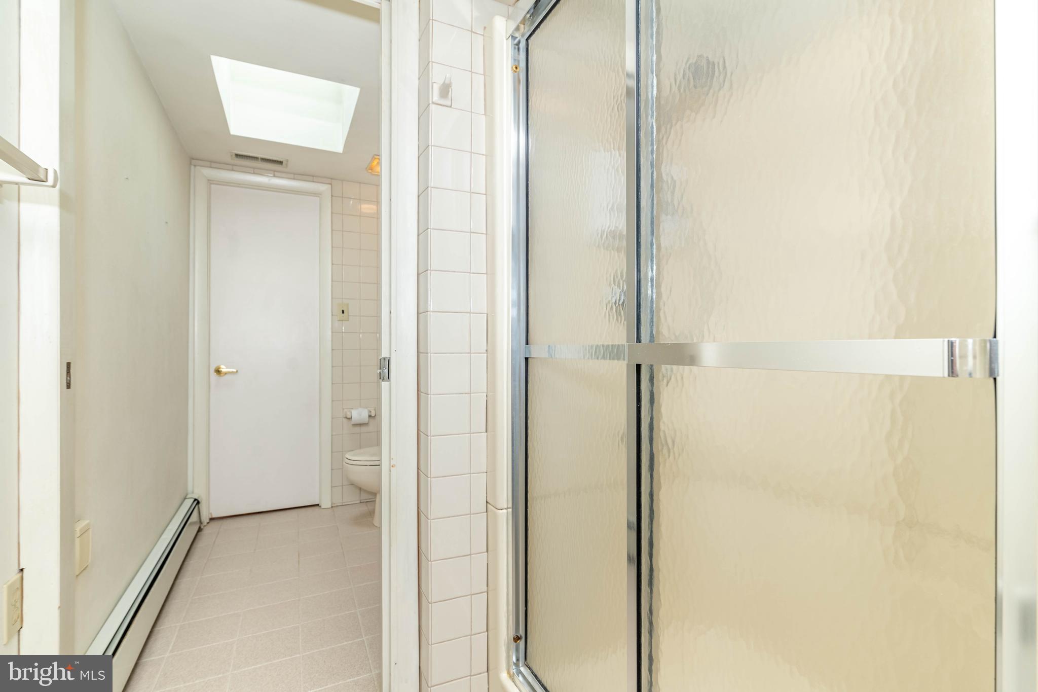 520 Powell Road Mount Holly, NJ 08060 - Photo 28 of 65 a view of a bathroom with a glass shower door