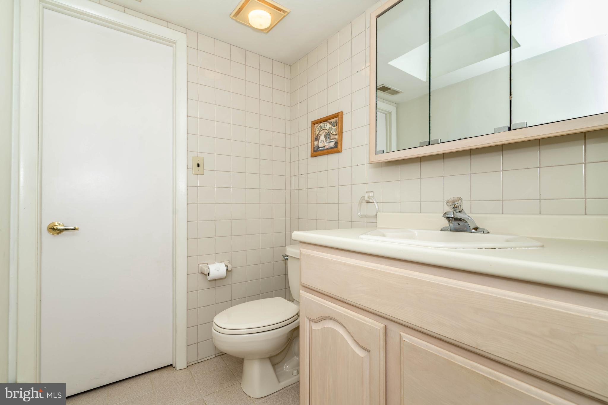 520 Powell Road Mount Holly, NJ 08060 - Photo 29 of 65 a bathroom with a sink a toilet and vanity