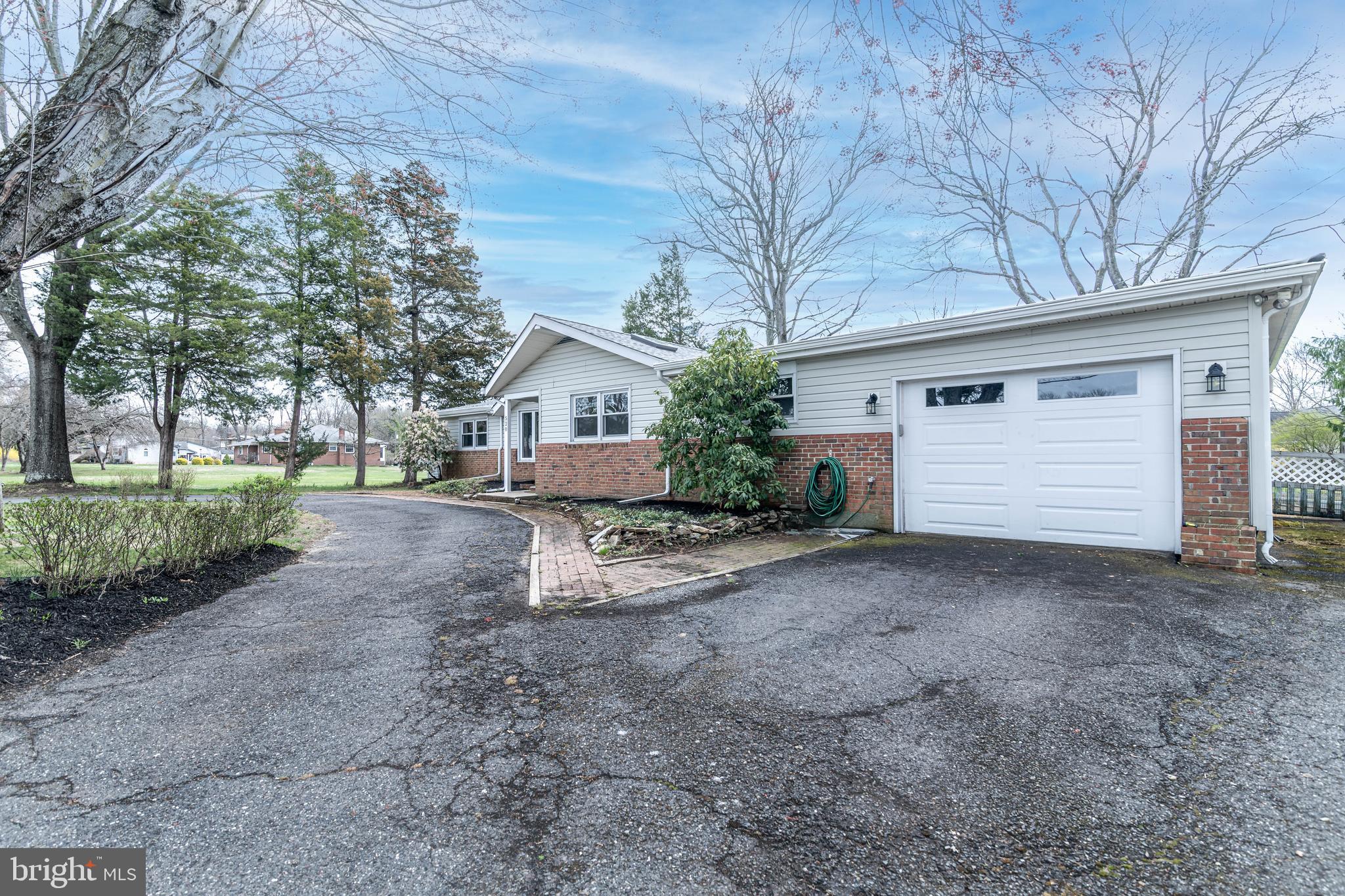 520 Powell Road Mount Holly, NJ 08060 - Photo 3 of 65 a view of a house with a yard and garage