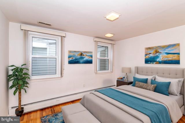 520 Powell Road Mount Holly, NJ 08060 - Photo 32 of 65 a bedroom with a bed and a potted plant