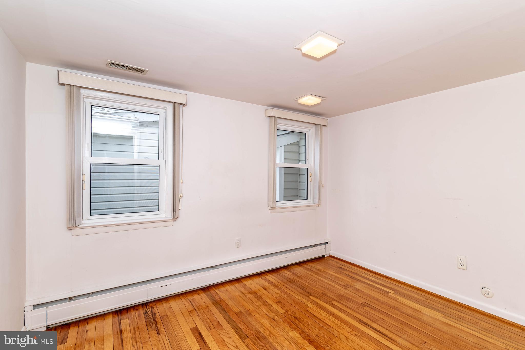 520 Powell Road Mount Holly, NJ 08060 - Photo 33 of 65 a view of an empty room with wooden floor and a window