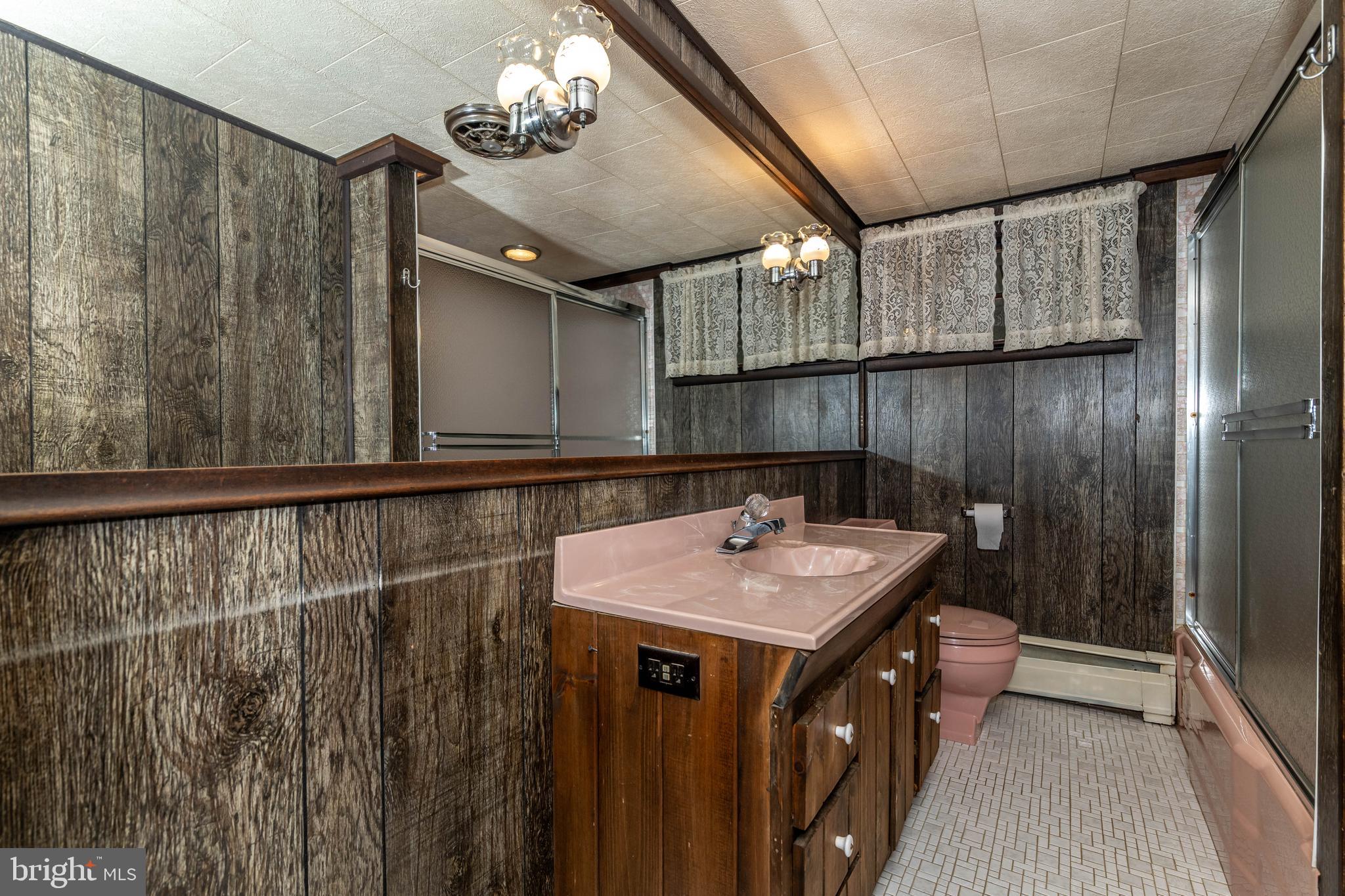 520 Powell Road Mount Holly, NJ 08060 - Photo 38 of 65 a bathroom with a sink a vanity and a mirror