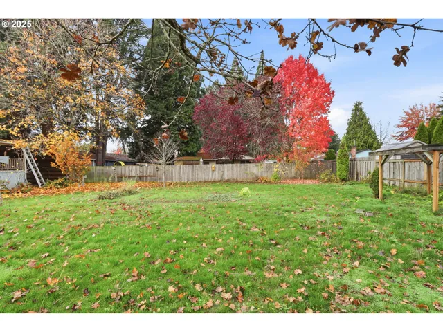 a backyard of a house with lots of green space
