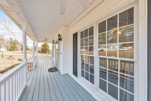 a view of a balcony with wooden floor