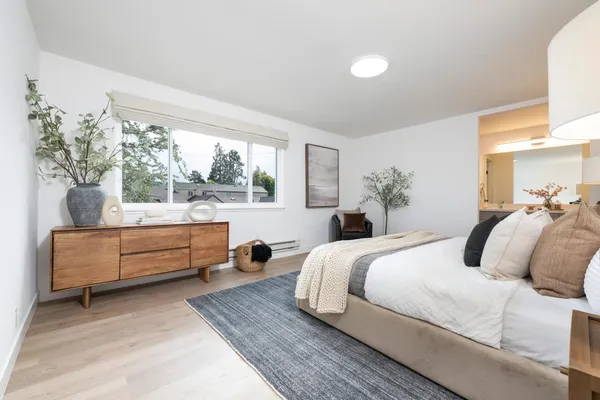 a bedroom with a bed and a couch