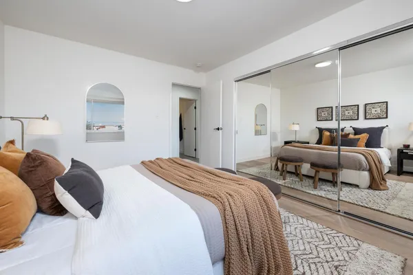 a bedroom with a bed and a window