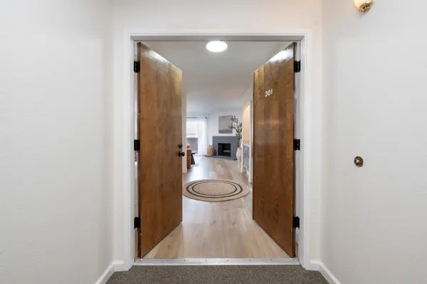 a view of a hallway with a bathroom