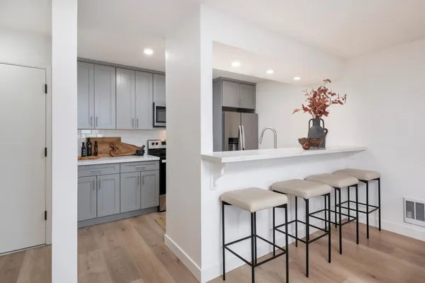 a kitchen with a table and chairs in it