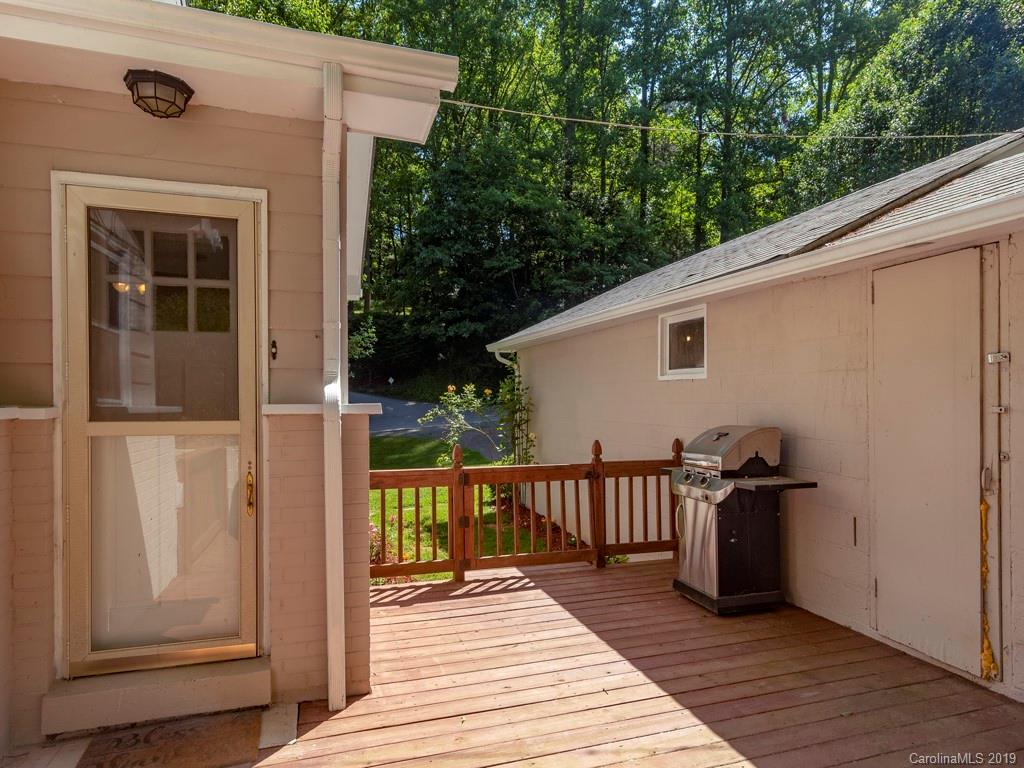 96 Pleasant Hill Road Clyde, NC 28721 - Photo 14 of 16 a view of a deck with wooden floor and outer view