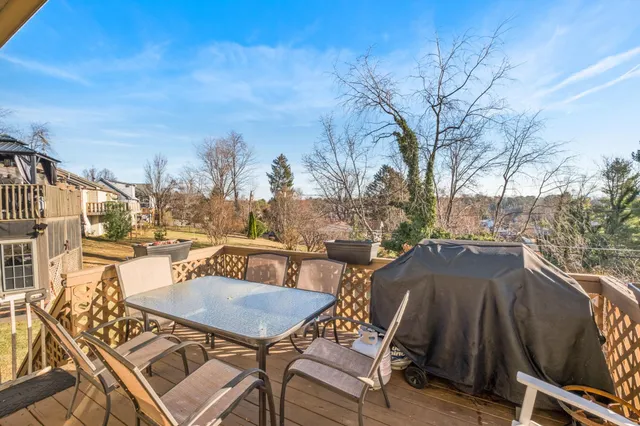 a view of a patio with table and chairs