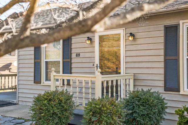 a view of a brick building next to a yard