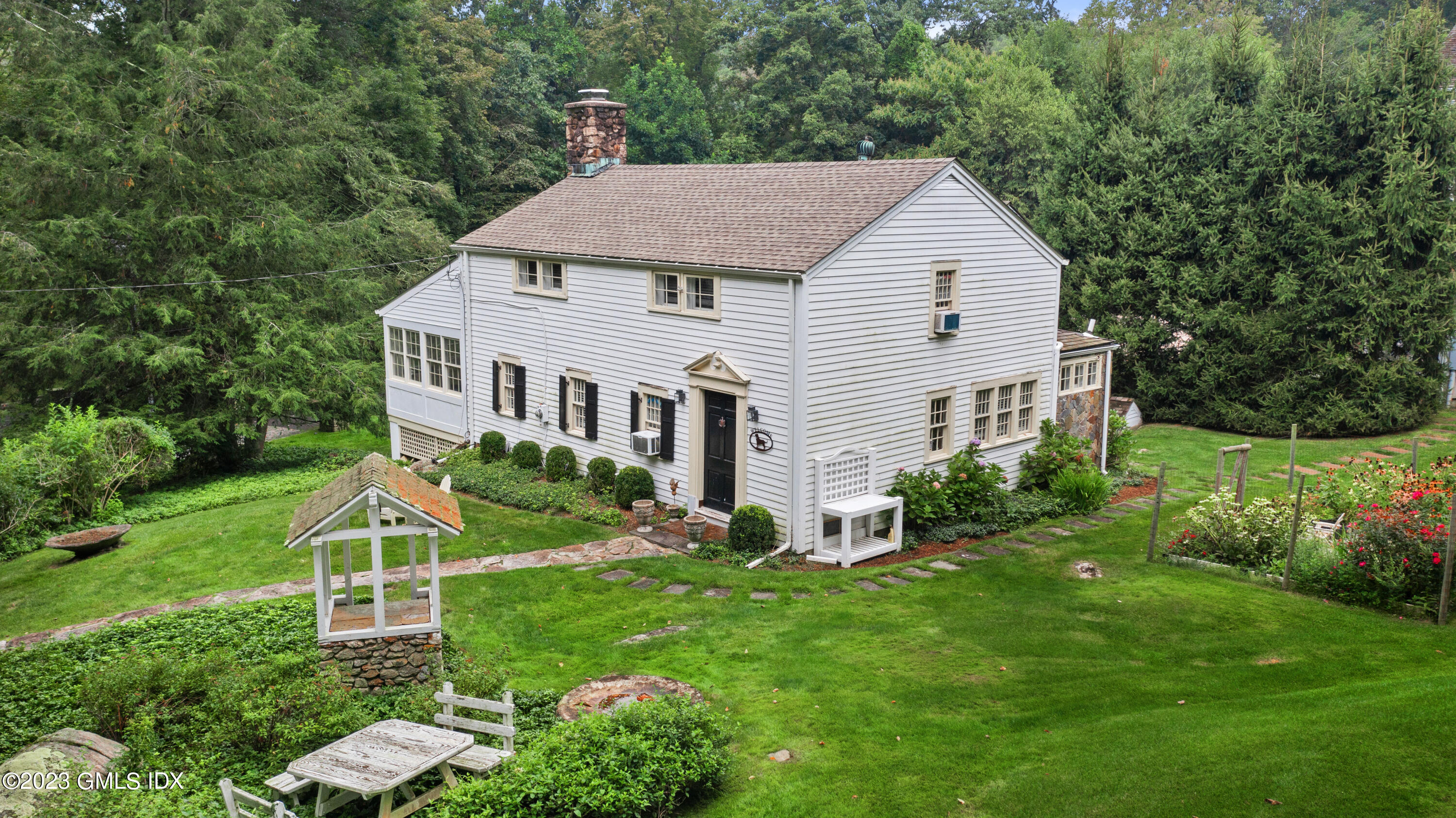 37 North Porchuck Road Greenwich, CT 06831 - Photo 47 of 63 a view of a house with backyard and garden