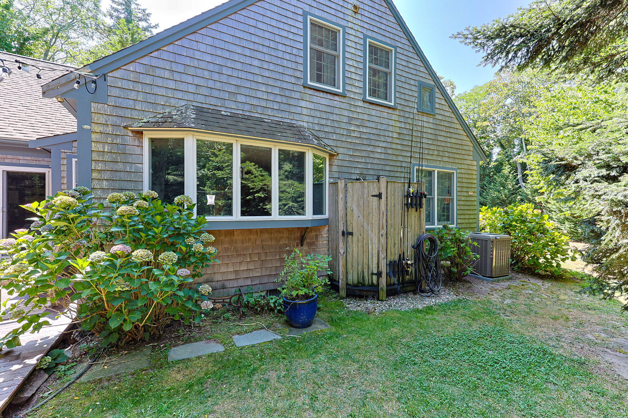 241 Tonset Road Orleans, MA 02653 - Photo 11 of 56 a view of a house with a yard and plants