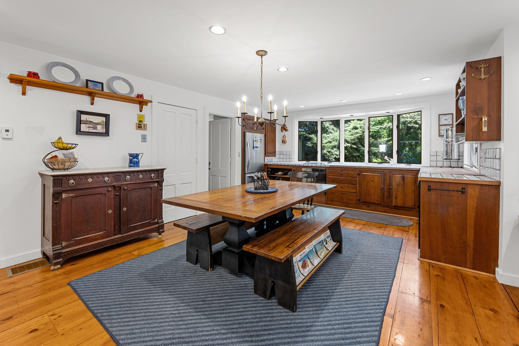 241 Tonset Road Orleans, MA 02653 - Photo 19 of 56 a living room with furniture a large window and wooden floor
