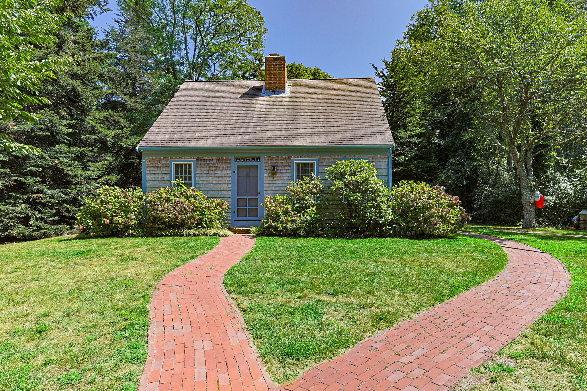 241 Tonset Road Orleans, MA 02653 - Photo 3 of 56 a front view of a house with a yard