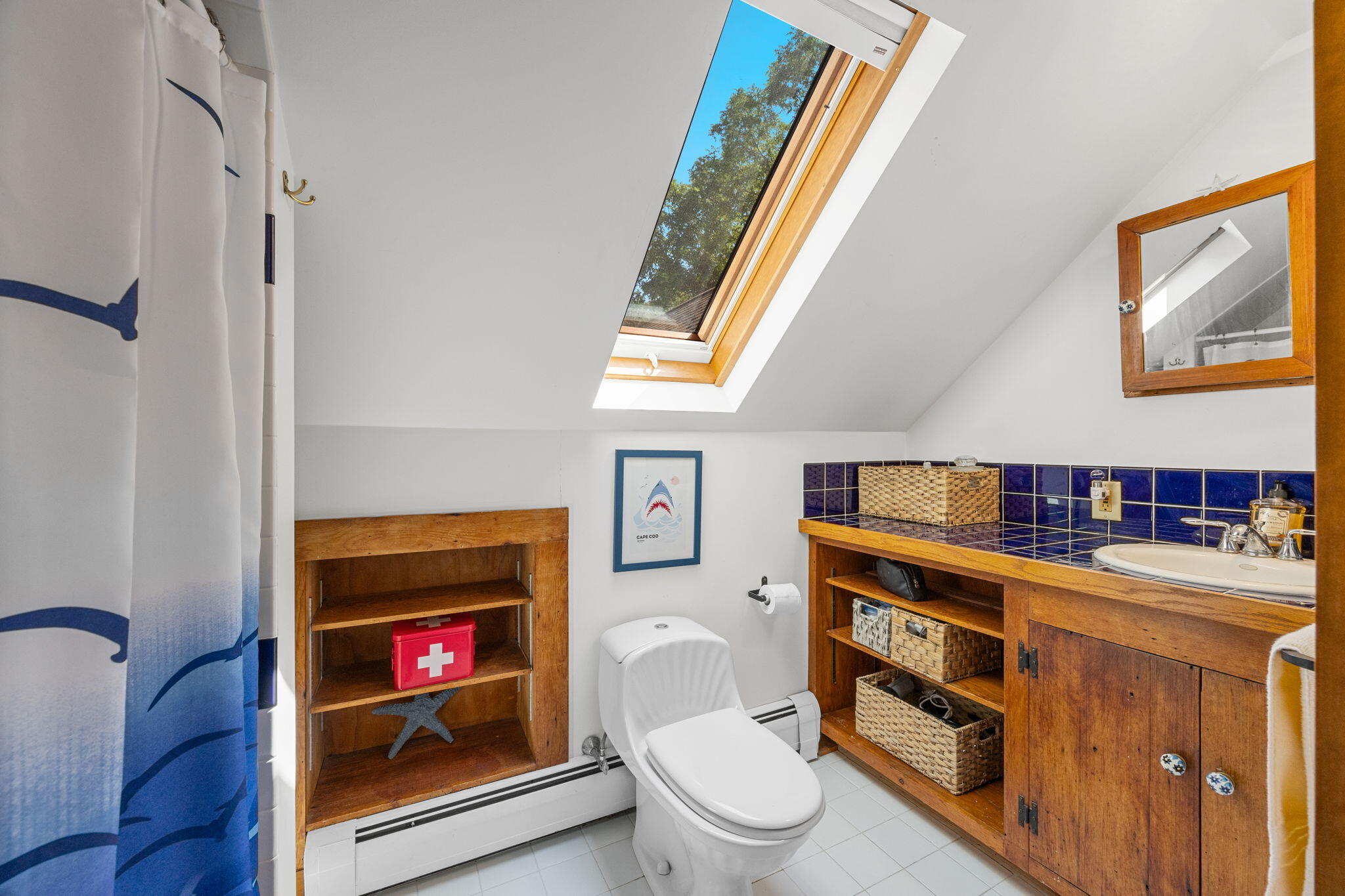 241 Tonset Road Orleans, MA 02653 - Photo 31 of 56 a living room with furniture a flat screen tv and a fireplace