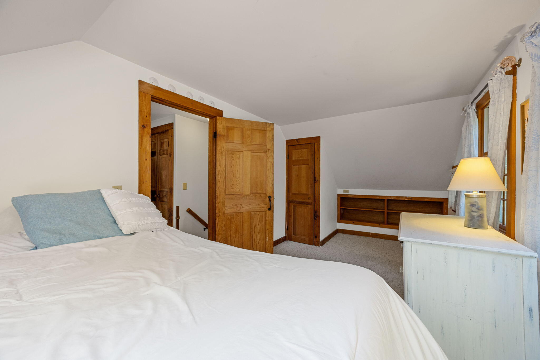 241 Tonset Road Orleans, MA 02653 - Photo 33 of 56 a bedroom with a bed and a couch