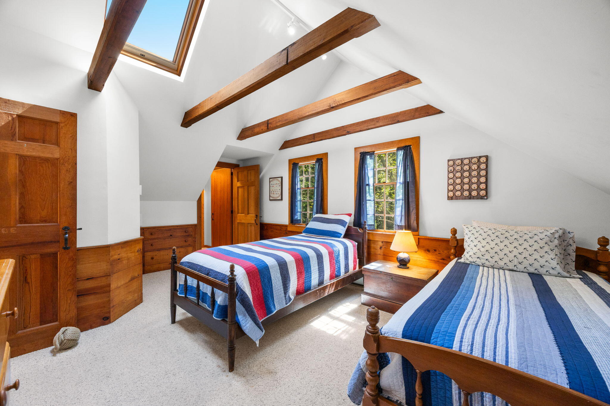 241 Tonset Road Orleans, MA 02653 - Photo 34 of 56 a spacious bedroom with a bed and wooden floor