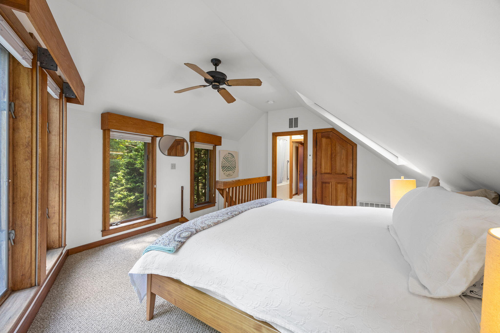 241 Tonset Road Orleans, MA 02653 - Photo 38 of 56 a bedroom with a bed and a large window with outer view