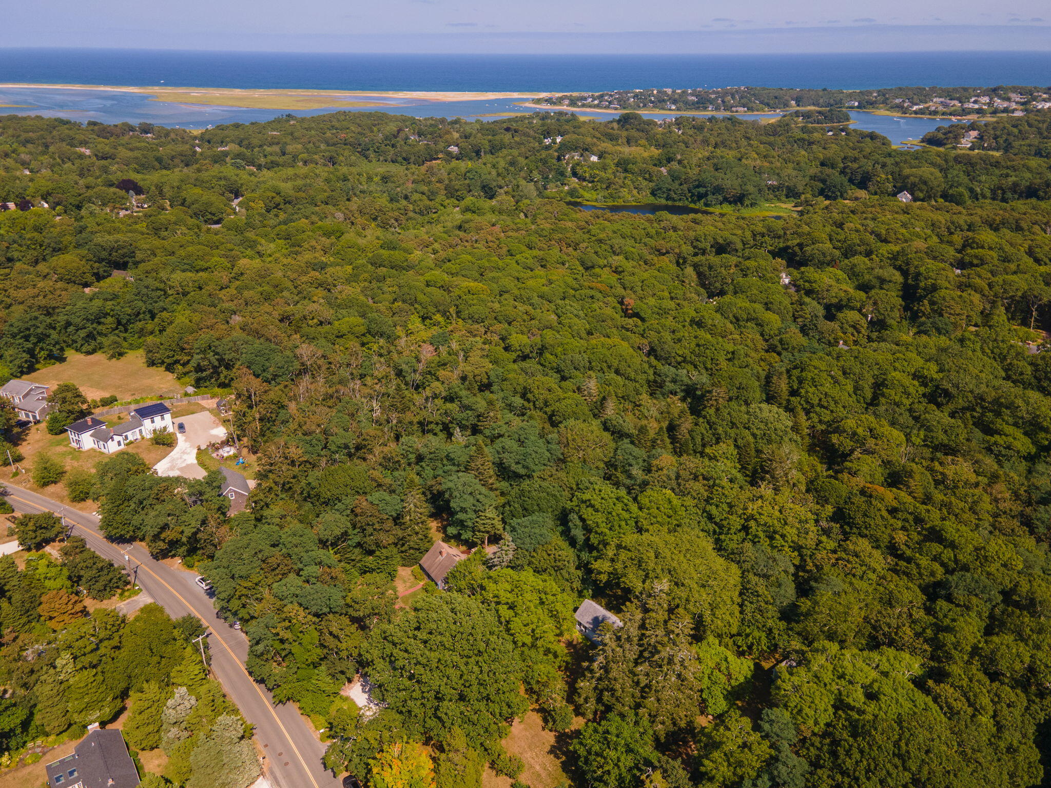 241 Tonset Road Orleans, MA 02653 - Photo 51 of 56 an aerial view of residential houses with outdoor space and trees