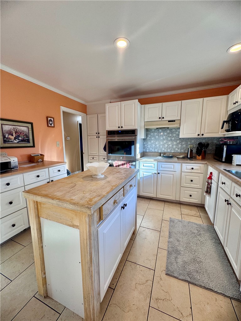 208 Pilgrim Circle Pickens, SC 29671 - Photo 16 of 29 Bright and functional kitchen featuring a central island, ample cabinetry, and practical tile flooring.