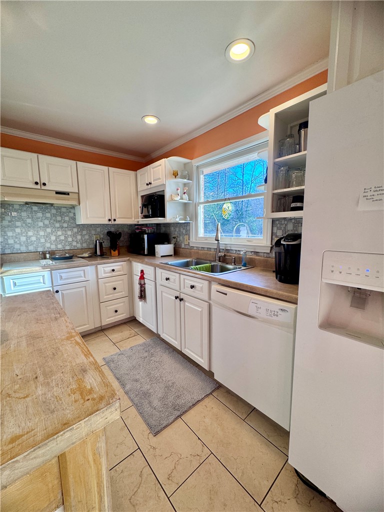 208 Pilgrim Circle Pickens, SC 29671 - Photo 17 of 29 This bright kitchen features white cabinetry, ample counter space, and modern appliances.